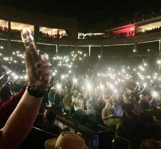 flashlights shine in a dark room