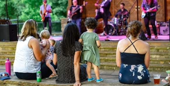Family of 5 watching concert