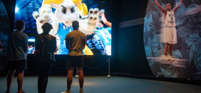 People Watching Video at Carolina Basketball Museum