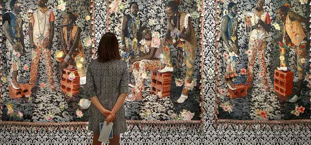Person viewing a tapestry