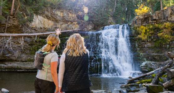 Two Girls looking at the Ousel Falls Waterfall