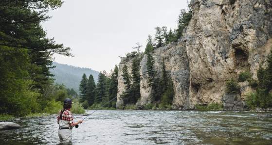 Woman fly-fishing in Big Sky