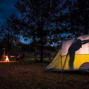 People inside a camping tent