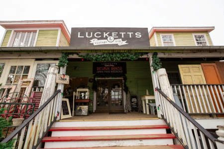 Exterior of Lucketts antique store decorated with holiday garland in Lucketts, Virginia.