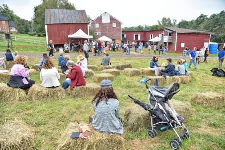 People enjoying an outdoor community event with live music and activities in Loudoun County