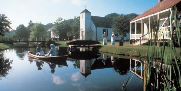 People In A Boat At LARC's Acadian Village In Lafayette, LA