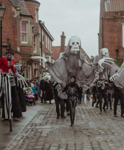 Many people in Halloween costumes at the Big Spook parade