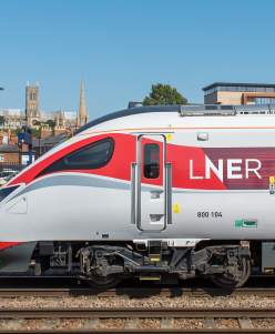 LNER train at Lincoln station with cathedral in distance