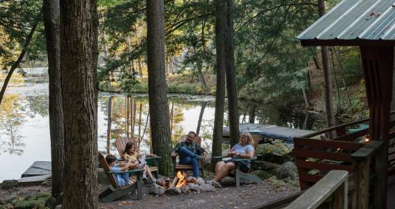 Family sitting around a fire