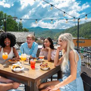 Friends on rooftop patio dining