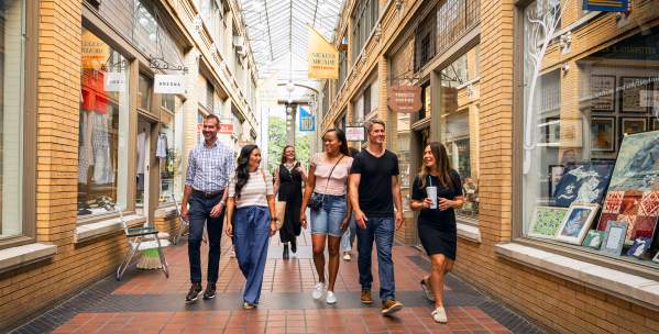 Group of professionals walking through Nickels Arcade