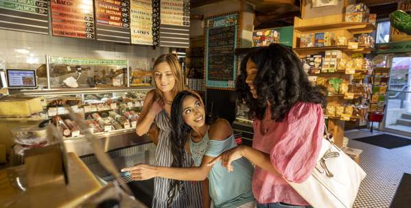 Three women at counter at Zingerman's Deli