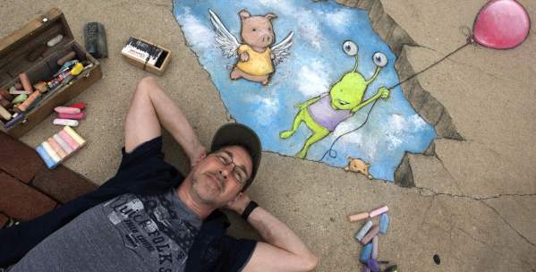 Artist David Zinn with chalk drawing