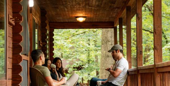 Benner's Meadow Run Campground cabin with people on porch