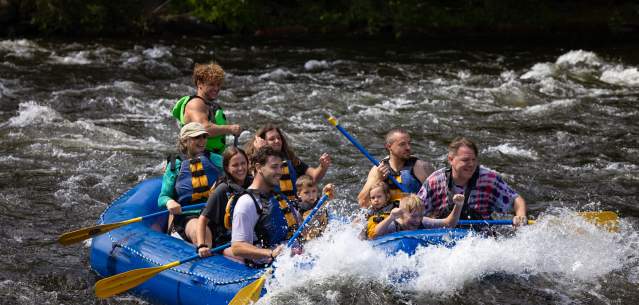 A group whitewater rafting with Adirondack Adventure Center