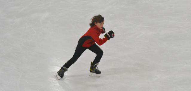 A boy ice skating at Glens Falls Recreation Center