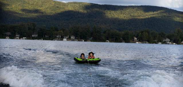 Two Family Members Tubing on Lake George