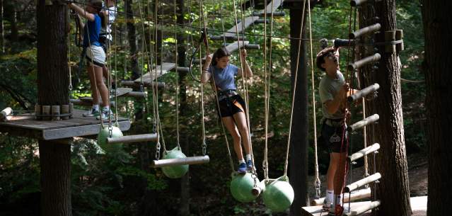 Kids going through an aerial course at Adirondack Extreme
