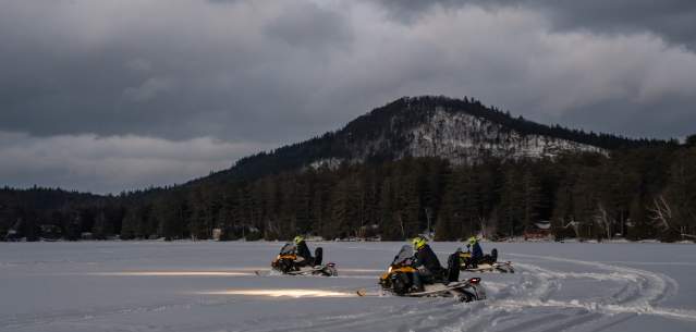 A group of snowmobilers on Loon Lake