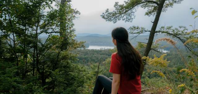 Hiker sitting on a summit