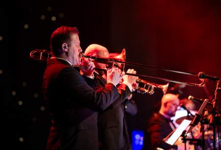 A live band playing brass instruments