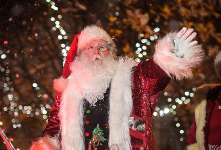 Father Christmas waving from his sleigh in the Swansea Christmas Parade
