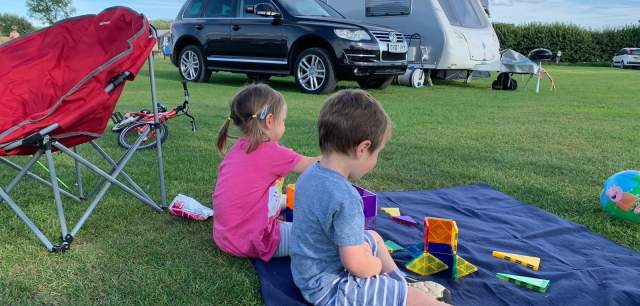 Two children at a camp site
