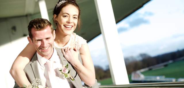 Uttoxeter Racecourse weddings Bride Groom piggyback