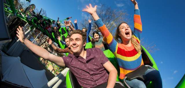 Drayton Manor Resort Theme Park Thrills arms in the air on Accelerator rollercoaster