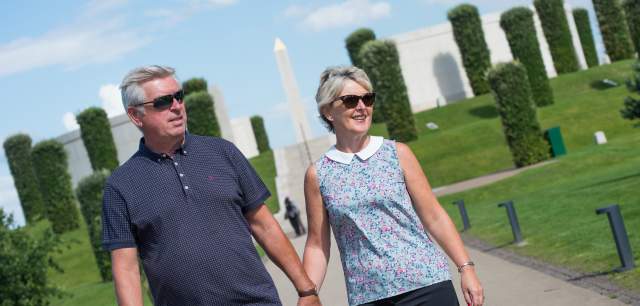 National Memorial Arboretum History Heritage couple walking in front of Armed Forces Memorial