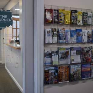 rack with brochures & maps with door with sign