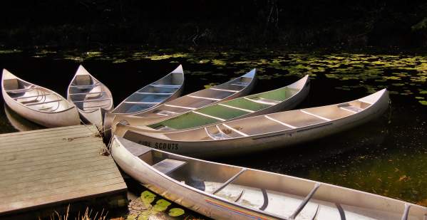 Canoes at Lake Cleawox on the Oregon Coast by Bonnie Melville