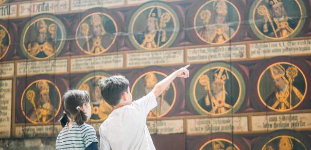 Two children looking at religious artwork at Chichester Cathedral