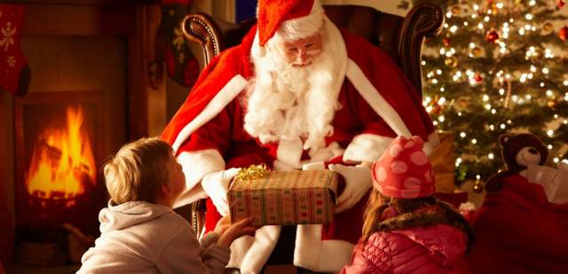 Father Christmas Sussex 2025 – child meeting Santa in a cosy festive woodland grotto