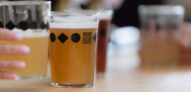 Two pints of craft beer on the bar at Three Legs Brewery, Sussex