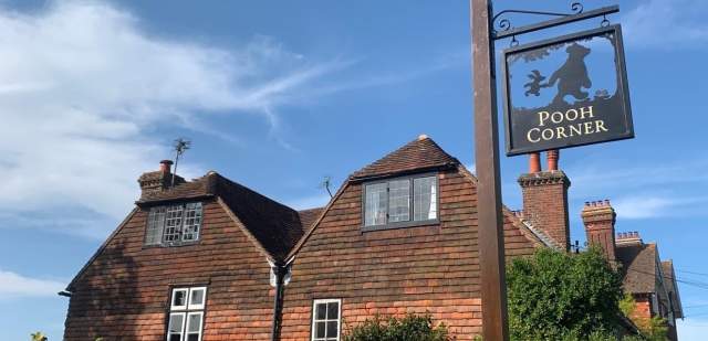 Pooh Corner sign, showing Winnie the Pooh and piglet