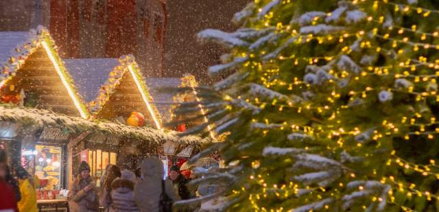 A christmas market and sparkling christmas tree