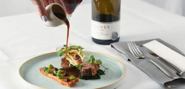 A plate of food and a bottle of wine at Bolney Estate, Sussex
