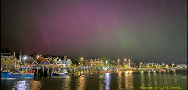 Newhaven at night, with lights refelcting off the water