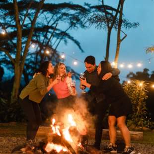 Visitors enjoy a bonfire at The Rock Restaurant in Boquete, Panama.