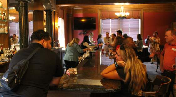 People talking at the Greystone Bar