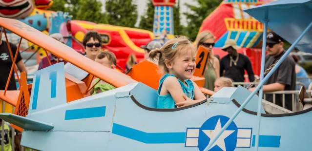 Little Girl On A Ride At Jiggy with the Piggy Festival in Kannapolis