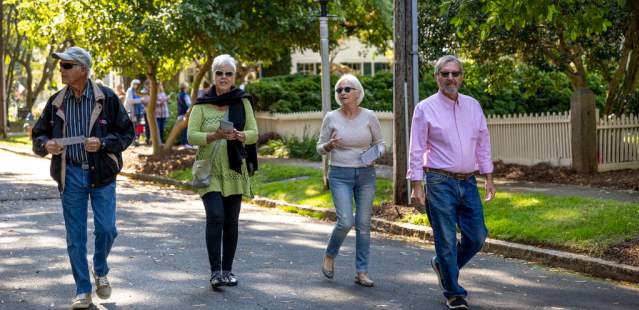 Group of people walking down street