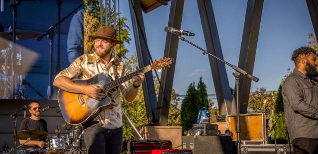 Band performing on an outdoor stage