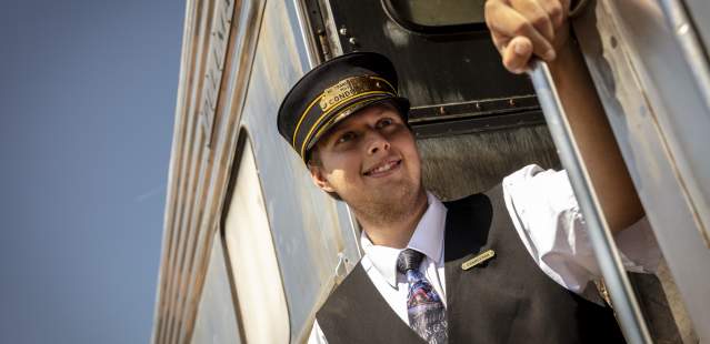 Conductor on side of train