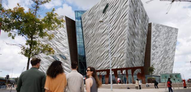 Group walking towards Titanic Belfast