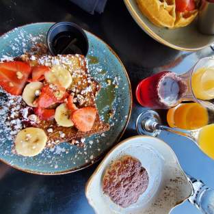 Breakfast of French toast and mimosas