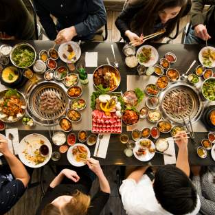 Above photo of group dining at korean BBQ