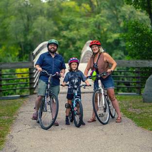 Family biking on Border to Border Trail