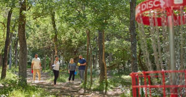 Friends playing Disc Golf